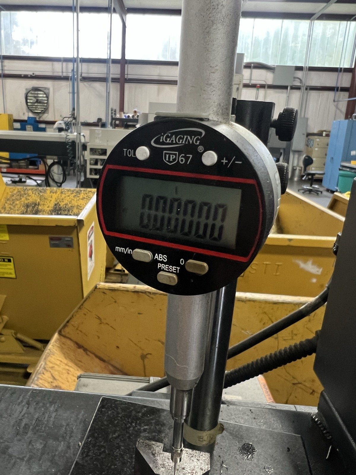 TXSwiss iGaging IP67 digital indicator dial gauge in use for tight-tolerance dimensional metrology at the Conroe, Texas precision Swiss CNC machining shop